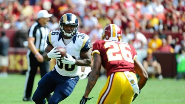 Sep 20, 2015; Landover, MD, USA; St. Louis Rams running back Benny Cunningham (36) rushes the ball as Washington Redskins cornerback Bashaud Breeland (26) defends during the second half at FedEx Field. The Washington Redskins won 24 – 10. Mandatory Credit: Brad Mills-USA TODAY Sports