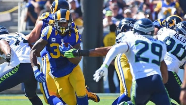 Sep 18, 2016; Los Angeles, CA, USA; Los Angeles Rams running back Todd Gurley (30) runs for a short gain in the second half of the game against the Seattle Seahawks at the Los Angeles Memorial Coliseum. Mandatory Credit: Jayne Kamin-Oncea-USA TODAY Sports