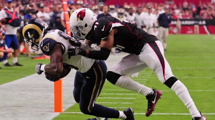 Oct 2, 2016; Glendale, AZ, USA; Los Angeles Rams wide receiver Brian Quick (83) catches a touchdown as Arizona Cardinals defensive back Marcus Cooper (41) defends during the second half at University of Phoenix Stadium. Mandatory Credit: Matt Kartozian-USA TODAY Sports