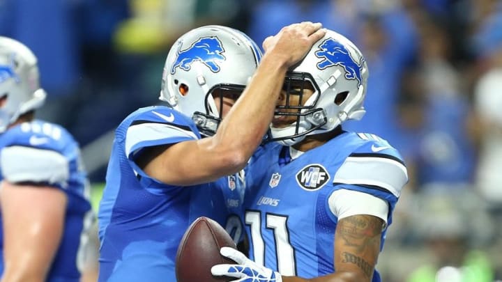 Oct 9, 2016; Detroit, MI, USA; Detroit Lions quarterback Matthew Stafford (9) and Detroit Lions wide receiver Marvin Jones (11) celebrate a touchdown during the first half of a game against the Philadelphia Eagles at Ford Field. Mandatory Credit: Mike Carter-USA TODAY Sports