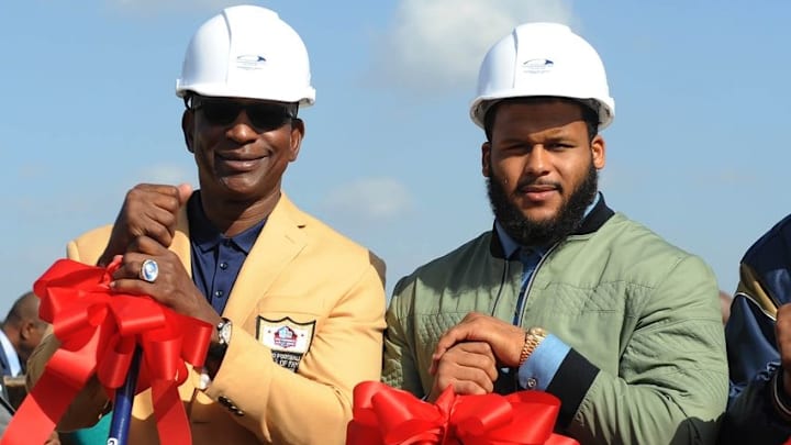 Nov 17, 2016; Inglewood, CA, USA; Los Angeles Rams former player Eric Dickerson poses for photographs with current player Aaron Donald at groundbreaking ceremonies at L.A. Stadium and Entertainment District at Hollywood Park. Mandatory Credit: Gary A. Vasquez-USA TODAY Sports