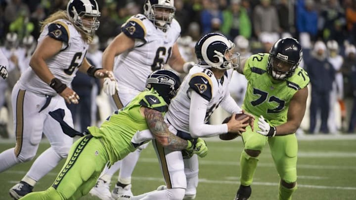 Dec 15, 2016; Seattle, WA, USA; Seattle Seahawks outside linebacker Cassius Marsh (91) sacks Los Angeles Rams quarterback Jared Goff (16) at CenturyLink Field. The Seahawks won 24-3. Mandatory Credit: Troy Wayrynen-USA TODAY Sports