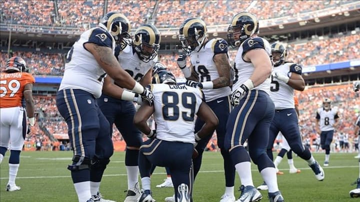 Aug 24, 2013; Denver, CO, USA; St. Louis Rams tight end Jared Cook (89) is congratulated by his teammates for a touchdown catch during the first quarter against the Denver Broncos at Sports Authority Field . Mandatory Credit: Ron Chenoy-USA TODAY Sports