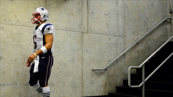 Aug 22, 2013; Detroit, MI, USA; New England Patriots quarterback Tim Tebow (5) walks to the field prior to a during a preseason game against the Detroit Lions at Ford Field. Mandatory Credit: Andrew Weber-USA TODAY Sports