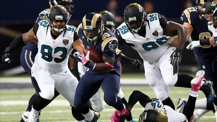 Oct 6, 2013; St. Louis, MO, USA; St. Louis Rams running back Zac Stacy (30) carries the ball during the first quarter against the Jacksonville Jaguars at The Edward Jones Dome. Mandatory Credit: Scott Kane-USA TODAY Sports