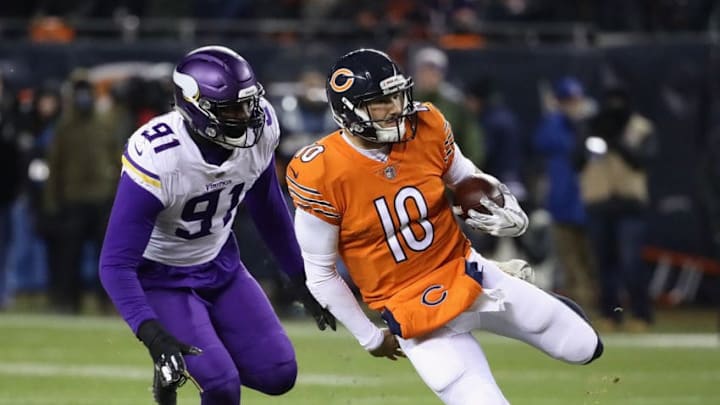 CHICAGO, IL - NOVEMBER 18: Mitchell Trubisky #10 of the Chicago Bears runs for a first down chased by Stephen Weatherly #91 of the Minnesota Vikings at Soldier Field on November 18, 2018 in Chicago, Illinois. The Bears defeated the Vikings 25-20. (Photo by Jonathan Daniel/Getty Images)