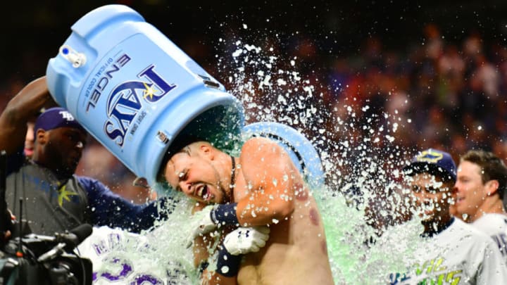 ST PETERSBURG, FLORIDA - SEPTEMBER 21: Nate Lowe #35 of the Tampa Bay Rays gets a water cooler bath after a 2-run walk-off against the Boston Red Sox in the eleventh inning of a baseball game at Tropicana Field on September 21, 2019 in St Petersburg, Florida. (Photo by Julio Aguilar/Getty Images)