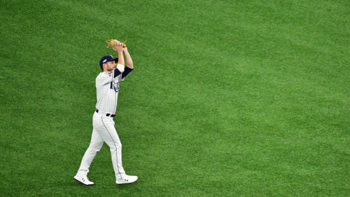 ST PETERSBURG, FLORIDA - OCTOBER 07: Brandon Lowe #8 of the Tampa Bay Rays makes a catch during the first inning against the Houston Astros in Game Three of the American League Division Series at Tropicana Field on October 07, 2019 in St Petersburg, Florida. (Photo by Julio Aguilar/Getty Images)