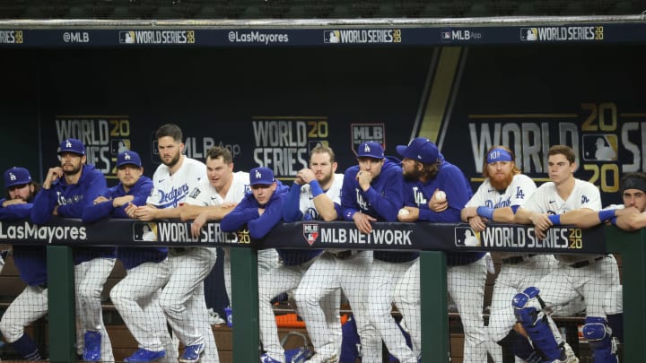 The Dodgers watch from the dugout as they lose to the Rays.