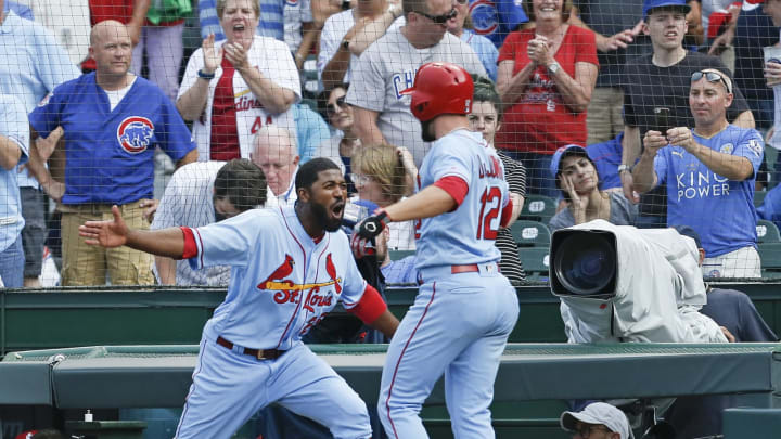 CHICAGO, ILLINOIS – SEPTEMBER 21: Paul DeJong #12 of the St. Louis Cardinals is congratulated by Dexter Fowler #25 following his solo home run during the ninth inning of a game against the Chicago Cubs at Wrigley Field on September 21, 2019 in Chicago, Illinois. (Photo by Nuccio DiNuzzo/Getty Images)