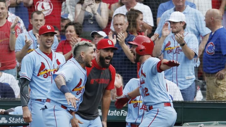 CHICAGO, ILLINOIS - SEPTEMBER 21: Paul DeJong #12 of the St. Louis Cardinals is congratulated by his teammates following his home run during the ninth inning of a game against the Chicago Cubs at Wrigley Field on September 21, 2019 in Chicago, Illinois. (Photo by Nuccio DiNuzzo/Getty Images)