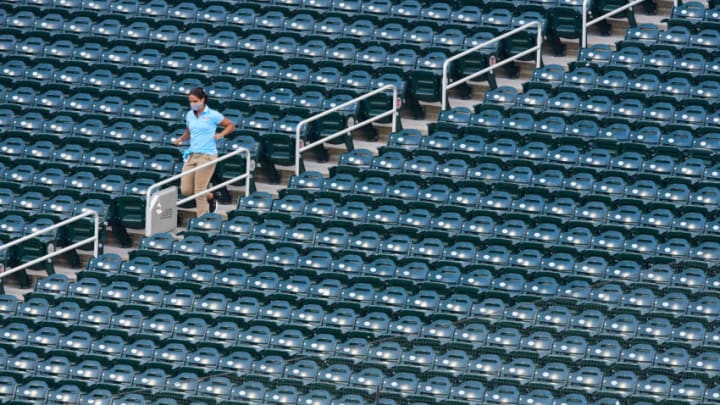 MINNEAPOLIS, MINNESOTA - JULY 29: A worker runs down the stairs to retrieve a foul ball during the game between the Minnesota Twins and the St. Louis Cardinals at Target Field on July 29, 2020 in Minneapolis, Minnesota. The Twins defeated the Cardinals 3-0. (Photo by Hannah Foslien/Getty Images)