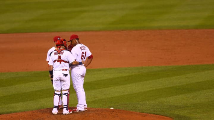 ST. LOUIS, MO - SEPTEMBER 29: Yadier Molina #4 talks to starter Alex Reyes #61 of the St. Louis Cardinals during a Cincinnati Reds at bat in the sixth inning at Busch Stadium on September 29, 2016 in St. Louis, Missouri. (Photo by Dilip Vishwanat/Getty Images)