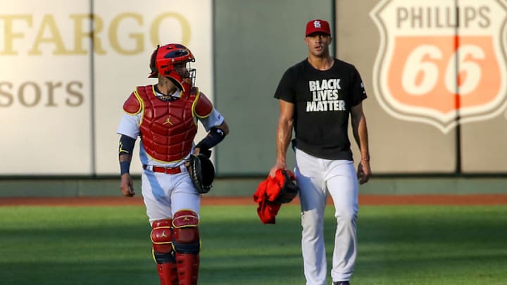 ST. LOUIS, MO - JULY 24: Yadier Molina #4 and Jack Flaherty #22 of the St. Louis Cardinals walk toward the dugout prior to the Opening Day game against the Pittsburgh Pirates at Busch Stadium on July 24, 2020 in St. Louis, Missouri. The 2020 season had been postponed since March due to the COVID-19 pandemic. (Photo by Scott Kane/Getty Images)