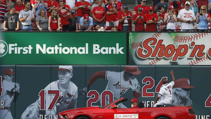 ST. LOUIS, MO – AUGUST 4: St. Louis Cardinals hall of fame shortstop Ozzie Smith waves to fans during a pre-game ceremony celebrating the 30 year anniversary of the 1982 World Series before a baseball game against the Milwaukee Brewers at Busch Stadium on August 4, 2012 in St. Louis, Missouri. (Photo by Paul Nordmann/Getty Images)