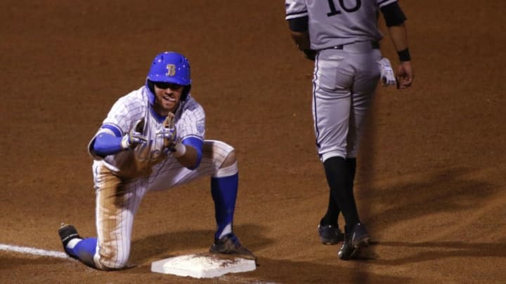 LOS ANGELES, CALIFORNIA - MAY 07: Garrett Mitchell #5 of UCLA gestures toward the dugout after hitting a triple during a baseball game against Long Beach State at Jackie Robinson Stadium on May 07, 2019 in Los Angeles, California. (Photo by Katharine Lotze/Getty Images)