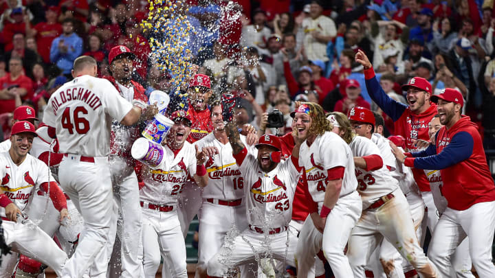 May 23, 2022; St. Louis, Missouri, USA; St. Louis Cardinals first baseman Paul Goldschmidt (46) is congratulated by teammates at home plate after hitting a walk-off grand slam against the Toronto Blue Jays during the tenth inning at Busch Stadium. Mandatory Credit: Jeff Curry-USA TODAY Sports
