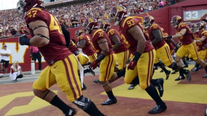 Oct 24, 2015; Los Angeles, CA, USA; The Southern California Trojans run out onto the field prior to the game against the Utah Utes at Los Angeles Memorial Coliseum. Mandatory Credit: Kelvin Kuo-USA TODAY Sports
