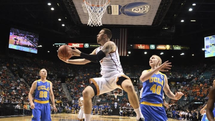 March 9, 2016; Las Vegas, NV, USA; UCLA Bruins guard Prince Ali (5) shoots the basketball against UCLA Bruins center Thomas Welsh (40) during the second half of the Pac-12 Conference tournament at MGM Grand Garden Arena. The Trojans defeated the Bruins 95-71. Mandatory Credit: Kyle Terada-USA TODAY Sports