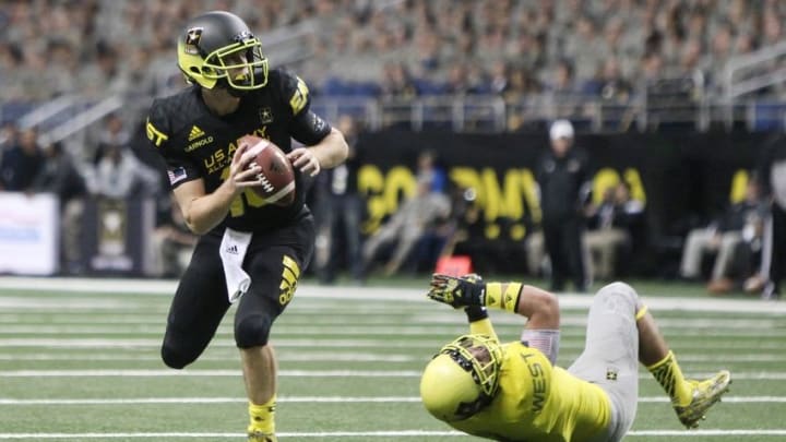 Jan 3, 2015; San Antonio, TX, USA; East quarterback Sam Darnold (18) gets away from West linebacker Osa Masina (3) in the U.S. Army All-American Bowl at the Alamodome. West beat East 39-36. Mandatory Credit: Erich Schlegel-USA TODAY Sports