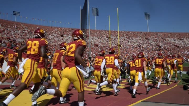Oct 8, 2016; Los Angeles, CA, USA; USC Trojans players run onto the field during a NCAA football game against the Colorado Buffaloes at Los Angeles Memorial Coliseum. Mandatory Credit: Kirby Lee-USA TODAY Sports