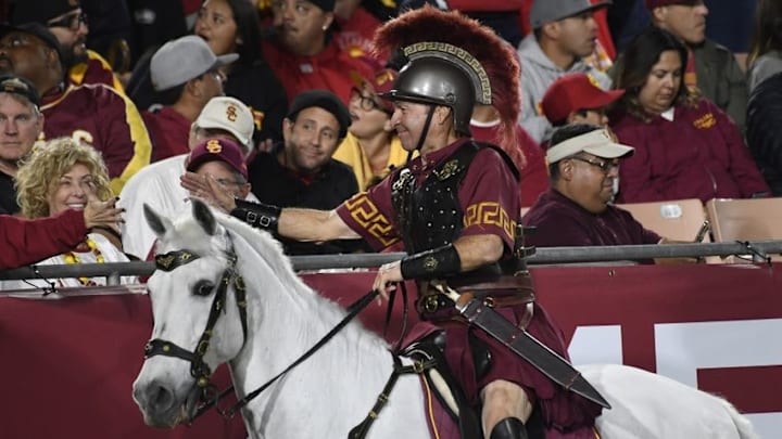 Oct 27, 2016; Los Angeles, CA, USA; Hector Aguilar rides USC mascot Traveler during the game between the California Golden Bears and the USC Trojans at Los Angeles Memorial Coliseum. Mandatory Credit: Richard Mackson-USA TODAY Sports