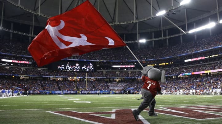 ATLANTA, GA - DECEMBER 5: Mascot Big Al of the Alabama Crimson Tide carries a flag across the field in the third quarter during the SEC Championship game against the Florida Gators at the Georgia Dome on December 5, 2015 in Atlanta, Georgia. (Photo by Mike Zarrilli/Getty Images)