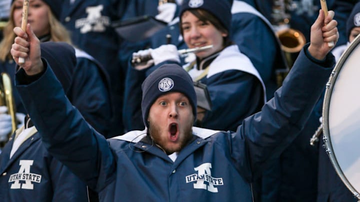 BOISE, ID - DECEMBER 22: A Utah State Aggies fan cheers during second half action at the Famous Idaho Potato Bowl between the Utah State Aggies and the Akron Zips on December 22, 2015 at Albertsons Stadium in Boise, Idaho. Akron won the game 23-21. (Photo by Loren Orr/Getty Images) BOISE, ID - DECEMBER 22: A Utah State Aggies fan cheers during second half action at the Famous Idaho Potato Bowl between the Utah State Aggies and the Akron Zips on December 22, 2015 at Albertsons Stadium in Boise, Idaho. Akron won the game 23-21. (Photo by Loren Orr/Getty Images)