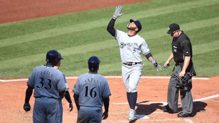 Sep 4, 2016; Pittsburgh, PA, USA; Milwaukee Brewers pinch hitter Jonathan Villar (5) gestures crossing home plate on a pinch hit grand slam home run against the Pittsburgh Pirates during the sixth inning at PNC Park. Mandatory Credit: Charles LeClaire-USA TODAY Sports