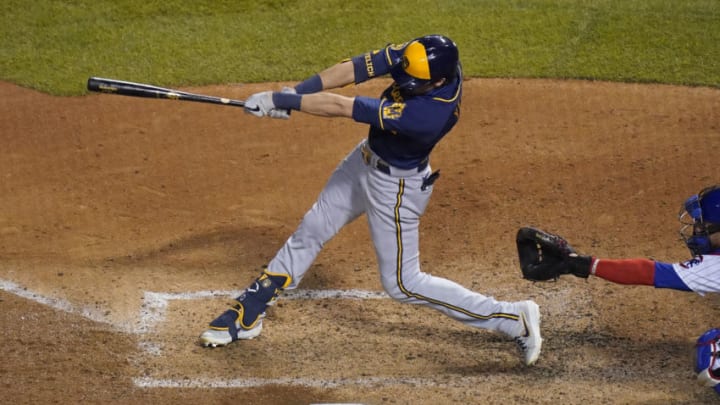 CHICAGO, ILLINOIS - AUGUST 14: Christian Yelich #22 of the Milwaukee Brewers hits a three run home run during the sixth inning of a game against the Chicago Cubs at Wrigley Field on August 14, 2020 in Chicago, Illinois. (Photo by Nuccio DiNuzzo/Getty Images)