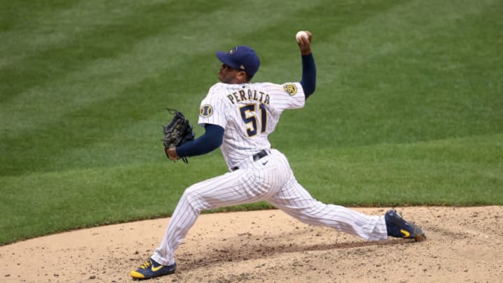 MILWAUKEE, WISCONSIN - AUGUST 27: Freddy Peralta #51 of the Milwaukee Brewers pitches in the fifth inning against the Cincinnati Reds during game two of a doubleheader at Miller Park on August 27, 2020 in Milwaukee, Wisconsin. Several sporting leagues across the nation are resuming their schedules after player walkouts done in protest over the shooting of Jacob Blake by Kenosha, Wisconsin police. (Photo by Dylan Buell/Getty Images)