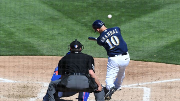 PHOENIX, ARIZONA - MARCH 10: Yasmani Grandal #10 of the Milwaukee Brewers doubles in a run during the third inning of a spring training game against the Chicago Cubs at Maryvale Baseball Park on March 10, 2019 in Phoenix, Arizona. (Photo by Norm Hall/Getty Images)