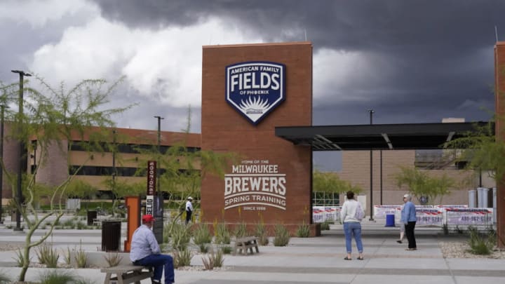 Mar 13, 2020; Phoenix, Arizona, USA; Fans walk around American Family Fields of Phoenix following the cancellation of a spring training game between the Cleveland Indians and Milwaukee Brewers due to the Covid 19 coronavirus outbreak. Major League Baseball is also delaying the start of the regular season by at least two weeks Mandatory Credit: Rick Scuteri-USA TODAY Sports