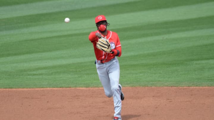 Mar 15, 2021; Tempe, Arizona, USA; Cincinnati Reds shortstop Dee Strange-Gordon throws to first base against the Los Angeles Angels during the first inning at Tempe Diablo Stadium. Mandatory Credit: Joe Camporeale-USA TODAY Sports