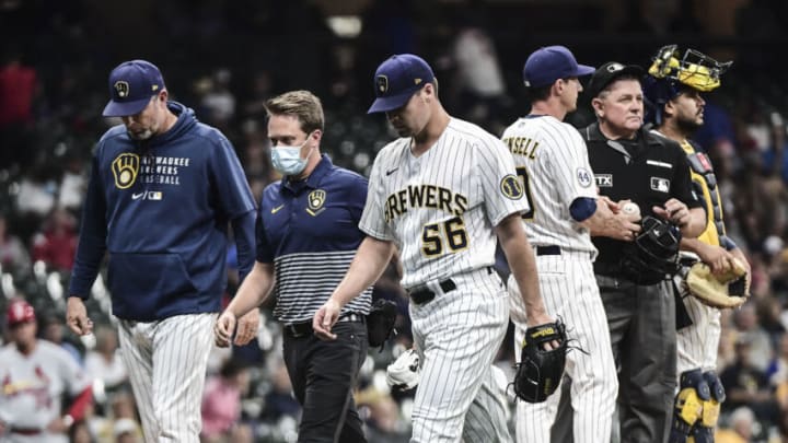Sep 3, 2021; Milwaukee, Wisconsin, USA; Milwaukee Brewers pitcher Justin Topa (56) leaves the game against the St. Louis Cardinals after suffering an apparent injury in the third inning at American Family Field. Mandatory Credit: Benny Sieu-USA TODAY Sports