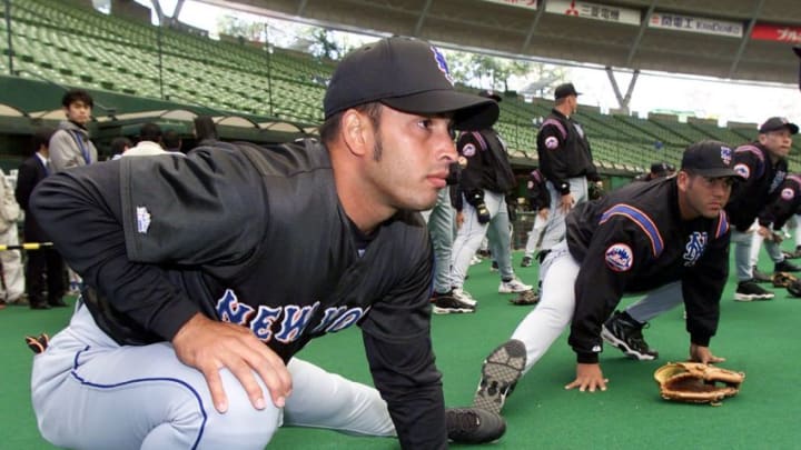 New York Mets' Rey Ordonez and his teammates warm up before a pre-season match with Japan's Seibu Lions at Seibu Dome in Tokorozawa, Saitama Prefecture, Japan 27 March, 2000. The Mets will play the first-ever official Major League Baseball game in Japan scheduled for a two-game season-opening series against the Chicago Cubs set for 29-30 March. (ELECTRONIC IMAGE) AFP PHOTO/Kazuhiro NOGI (Photo by Kazuhiro NOGI / AFP) (Photo by KAZUHIRO NOGI/AFP via Getty Images)