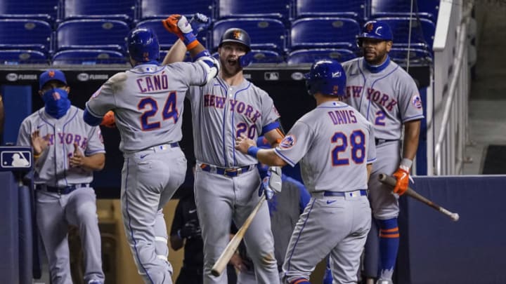 MIAMI, FLORIDA - AUGUST 17: Robinson Cano #24 of the New York Mets celebrates with Pete Alonso #20 after hitting his second homerun of the game in the sixth inning against the Miami Marlins at Marlins Park on August 17, 2020 in Miami, Florida. (Photo by Mark Brown/Getty Images)