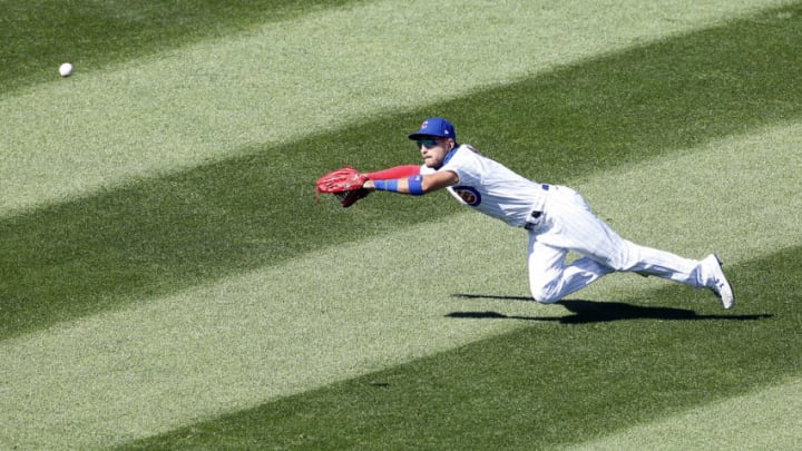 CHICAGO, ILLINOIS - AUGUST 19: Albert Almora Jr. #5 of the Chicago Cubs misses a double hit by Brad Miller #15 of the St. Louis Cardinals during the sixth inning of Game One of a doubleheader at Wrigley Field on August 19, 2020 in Chicago, Illinois. (Photo by Nuccio DiNuzzo/Getty Images)
