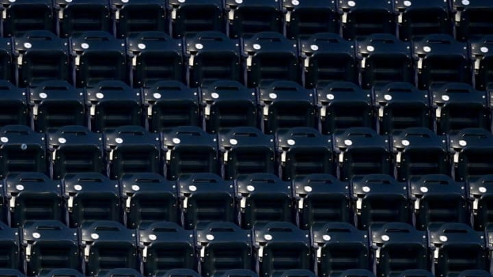 NEW YORK, NEW YORK - AUGUST 11: Mr. Met sits amongst empty seats with a mask on during the game between the New York Mets and the Washington Nationals at Citi Field on August 11, 2020 in New York City. Due to concerns of the spread of the coronavirus, MLB games are being played without fans. (Photo by Steven Ryan/Getty Images)