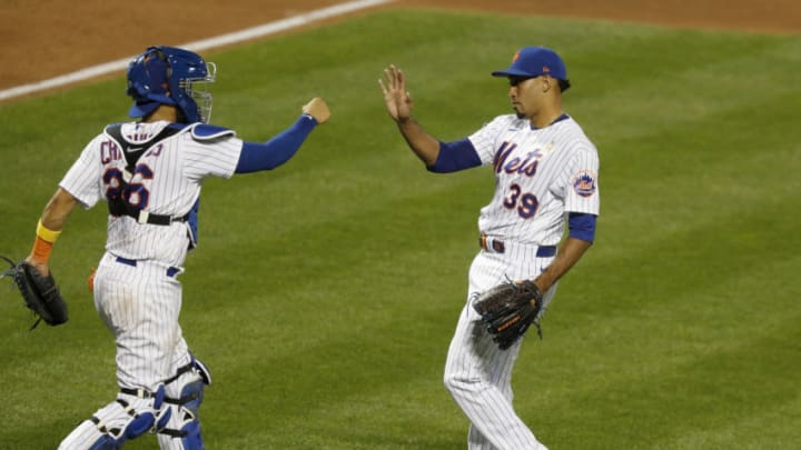 NEW YORK, NEW YORK - SEPTEMBER 05: Edwin Diaz #39 (R) and Robinson Chirinos #26 of the New York Mets in action against the Philadelphia Phillies at Citi Field on September 05, 2020 in New York City. The Mets defeated the Phillies 5-1. (Photo by Jim McIsaac/Getty Images)