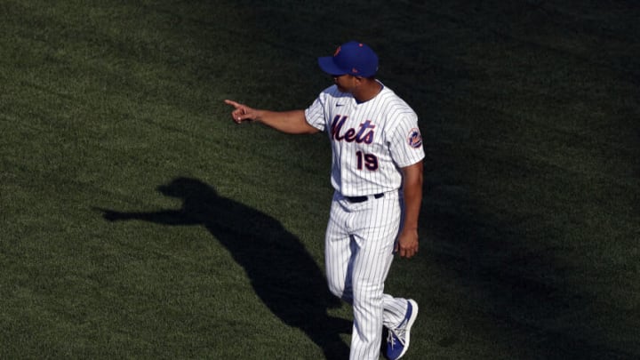 NEW YORK, NY - AUGUST 11: Luis Rojas #19 of the New York Mets signals for a pitching change during the fifth inning against the Washington Nationals at Citi Field on August 11, 2021 in New York City. This is a continuation of August 10 game which was suspended due to inclement weather. (Photo by Adam Hunger/Getty Images)