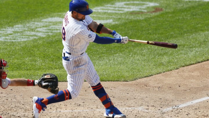 Sep 7, 2020; New York City, New York, USA; New York Mets third baseman J.D. Davis (28) singles against the Philadelphia Phillies during the seventh inning at Citi Field. Mandatory Credit: Andy Marlin-USA TODAY Sports