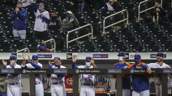 Apr 13, 2021; New York City, New York, USA; The New York Mets dugout reacts after pitcher Marcus Stroman draws a walk against the Philadelphia Phillies in the sixth inning at Citi Field. Mandatory Credit: Wendell Cruz-USA TODAY Sports