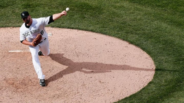 Apr 14, 2016; Denver, CO, USA; Colorado Rockies relief pitcher Boone Logan (48) delivers a pitch in the ninth inning against the San Francisco Giants at Coors Field. The Rockies defeated the Giants 11-6. Mandatory Credit: Isaiah J. Downing-USA TODAY Sports