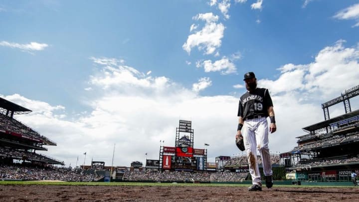 Jul 24, 2016; Denver, CO, USA; Colorado Rockies center fielder Charlie Blackmon (19) walks off the field in the middle of the fourth inning against the Atlanta Braves at Coors Field. Mandatory Credit: Isaiah J. Downing-USA TODAY Sports