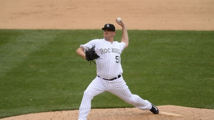 Jul 20, 2016; Denver, CO, USA; Colorado Rockies relief pitcher Jake McGee (51) delivers a pitch in the eighth inning against the Tampa Bay Rays at Coors Field. The Rays defeated the Rockies 11-3. Mandatory Credit: Ron Chenoy-USA TODAY Sports