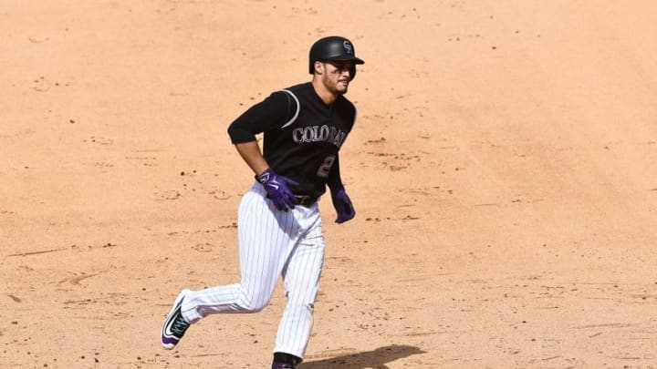 Aug 7, 2016; Denver, CO, USA; Colorado Rockies third baseman Nolan Arenado (28) rounds the bases after a three run home run in the fifth inning against the Miami Marlins at Coors Field. Mandatory Credit: Ron Chenoy-USA TODAY Sports