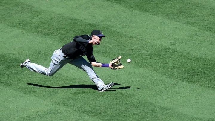 Sep 11, 2016; San Diego, CA, USA; Colorado Rockies left fielder David Dahl (26) makes a catch on a ball hit by San Diego Padres first baseman Wil Myers (not pictured) during the fourth inning at Petco Park. Mandatory Credit: Jake Roth-USA TODAY Sports