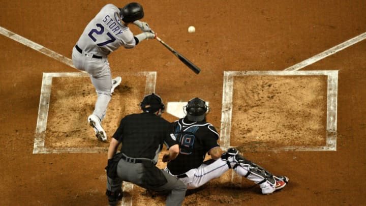 MIAMI, FL - MARCH 29: Trevor Story #27 of the Colorado Rockies at bat in the first inning during the game against the Miami Marlins at Marlins Park on March 29, 2019 in Miami, Florida. (Photo by Mark Brown/Getty Images)