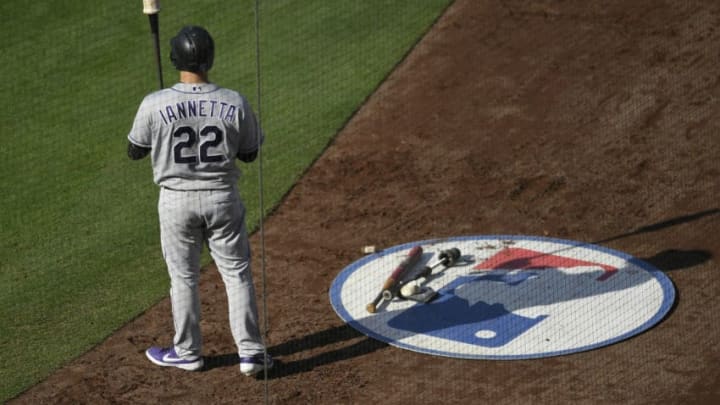 LOS ANGELES, CA - JUNE 22: Chris Iannetta #22 of the Colorado Rockies is on deck waiting for his at bat against the Los Angeles Dodgers in the third inning at Dodger Stadium on June 22, 2019 in Los Angeles, California. (Photo by John McCoy/Getty Images)